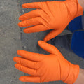 Orange gloves for gardening and household cleaning